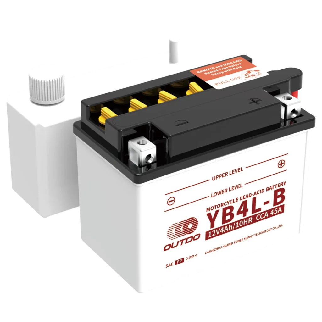 A white YB4L-B 12V 4Ah motorcycle flooded lead-acid battery with removable caps and electrolyte pack for filling.