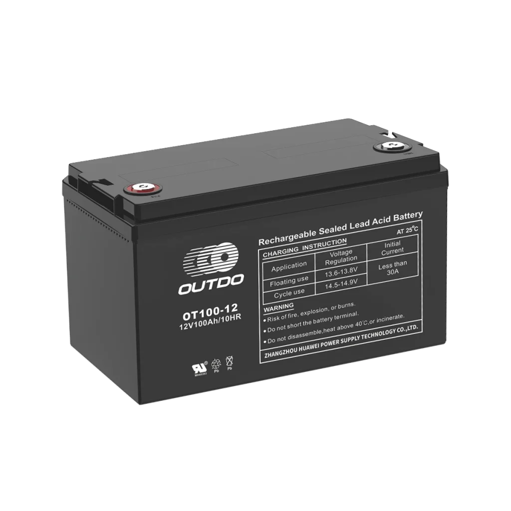 A black Outdo OT100-12 rechargeable sealed lead-acid battery. The battery has a label indicating it's a 12V 100Ah battery and provides charging instructions and warnings.