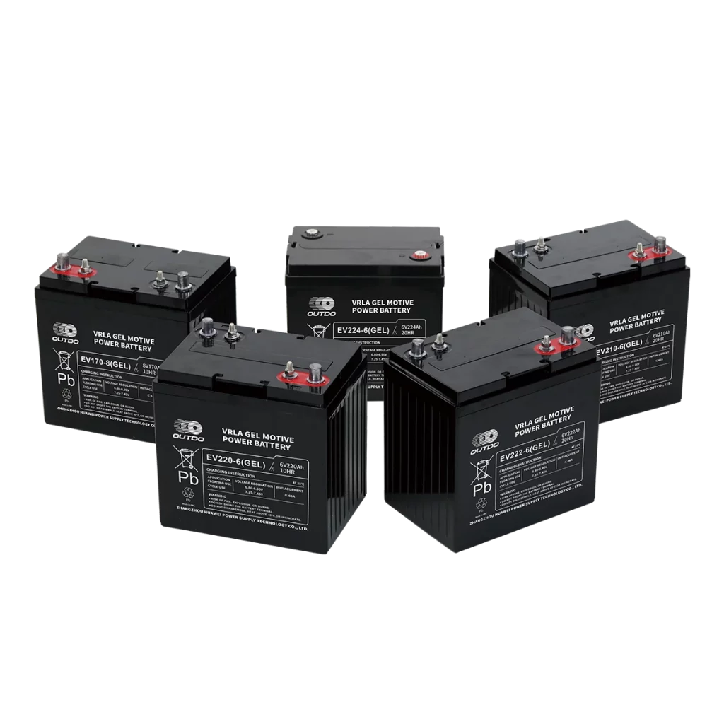 Five black Outdo VRLA gel motive power batteries are arranged in a semi-circle. The batteries are labeled with different model numbers and specifications. The text "VRLA GEL MOTIVE POWER BATTERY" is visible on each battery.